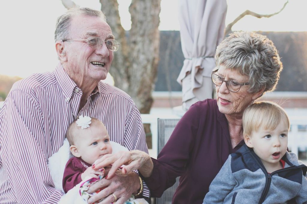 elderly couple with grand children