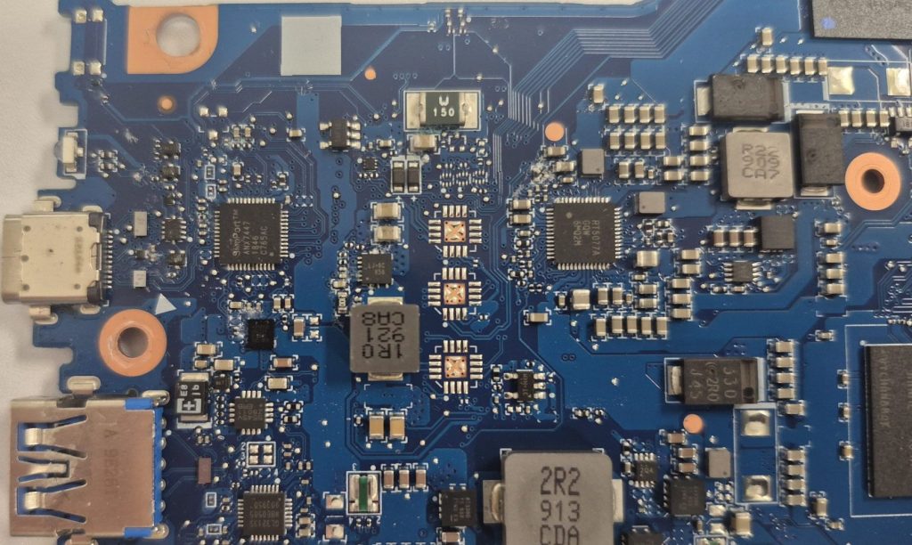 Acer Chromebook motherboard signs of liquid damage and corrosion forming on capacitors and chipsets